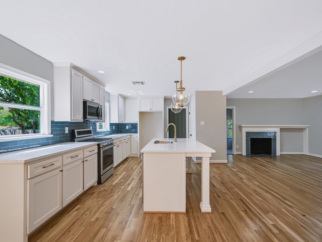 Kitchen beside a fireplace in an open plan home, Fort Worth