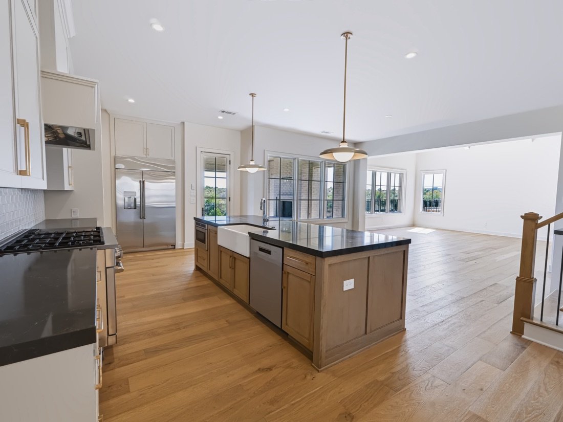 Kitchen and staircase in an open plan home, Fort Worth