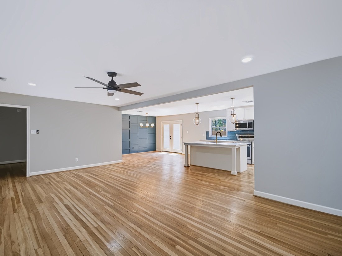 Open living room under a vaulted beamed ceiling, Fort Worth