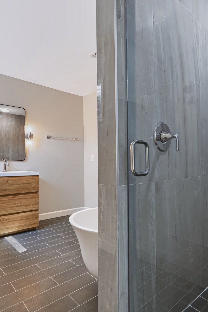 Walk-in shower with marble tile, Fort Worth