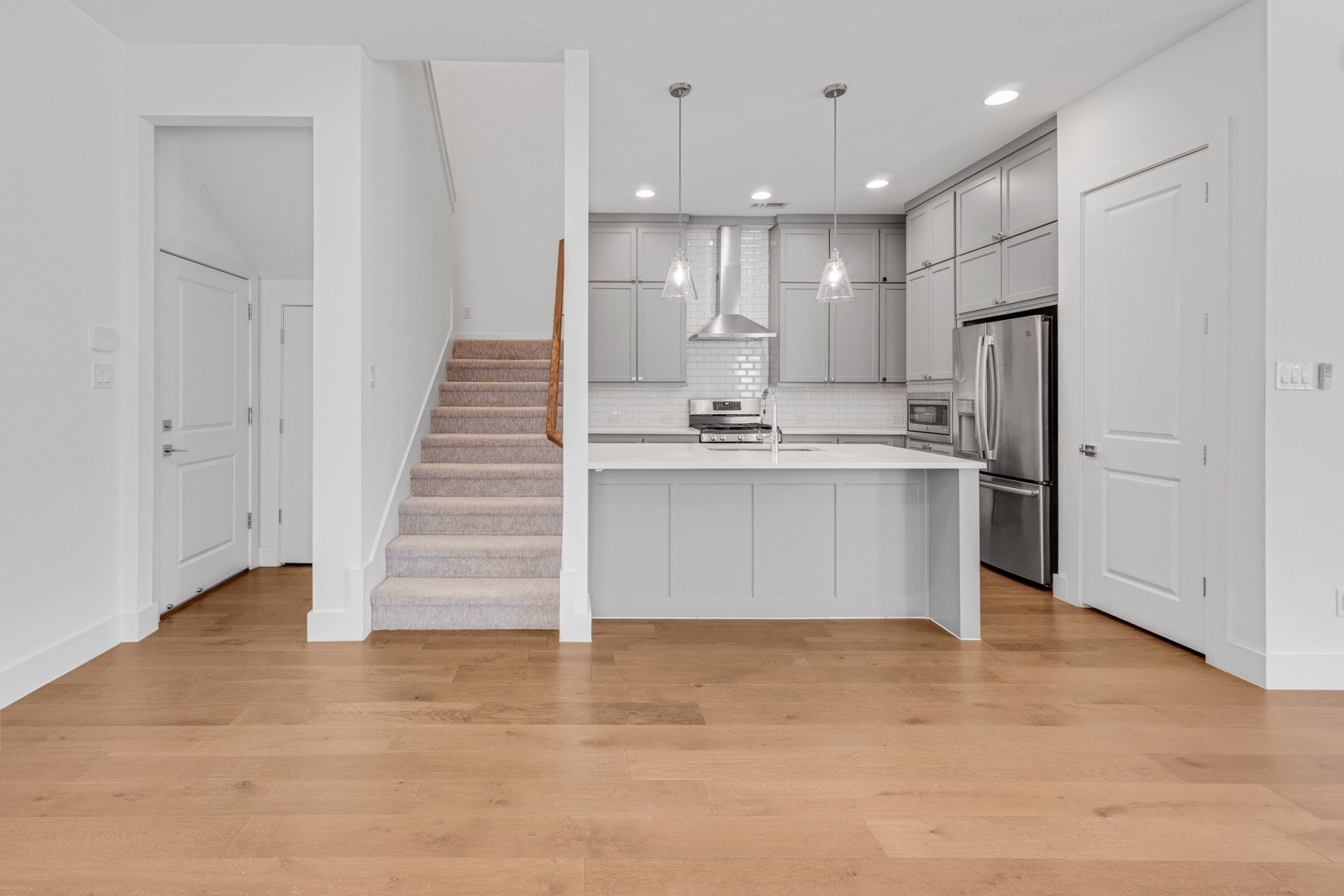 Kitchen and staircase at 2249 Bird St